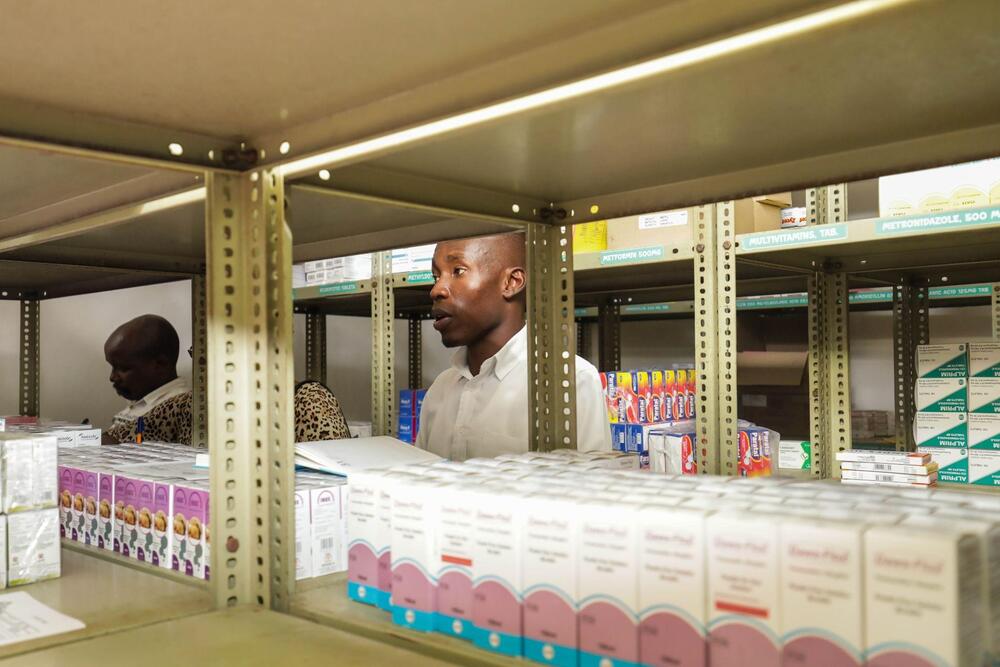 Mombasa County Acting County Pharmacist Dr. Edward Mbeya inspects the pharmacy store at Mrima Maternity Hospital, Mombasa County.