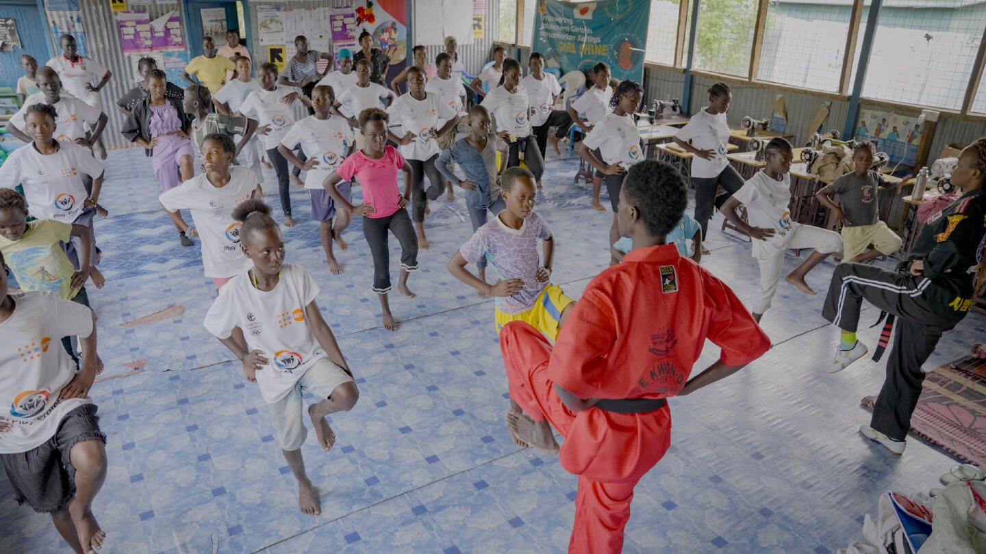 Adolescent girls aged 12 to 18 learning self-defense through Taekwondo, led by a skilled instructor.