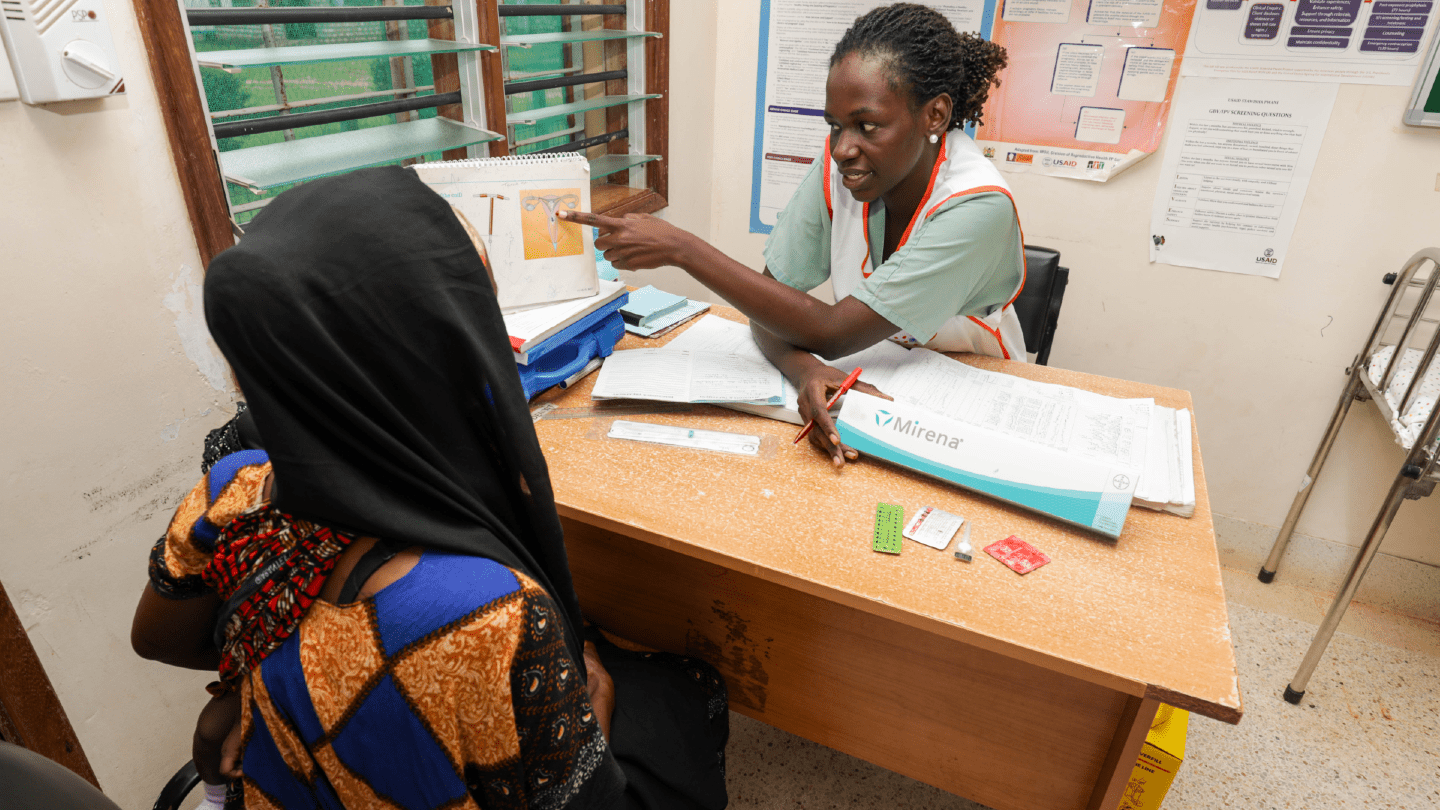 A woman receives guidance from a nurse on choosing the right family planning method