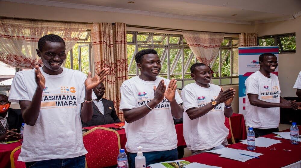 Young men take part in a group exercise during a Nitasimama Imara workshop in Elgeyo Marakwet County